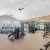 Fitness center with cardio equipment and natural light