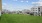 leash free pet park with green grass and gate